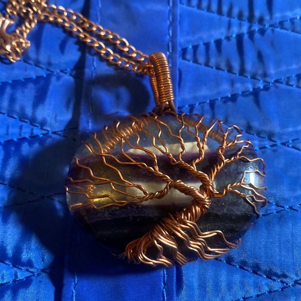 Hand wrapped Flourite, oblong wrapped in copper wiring